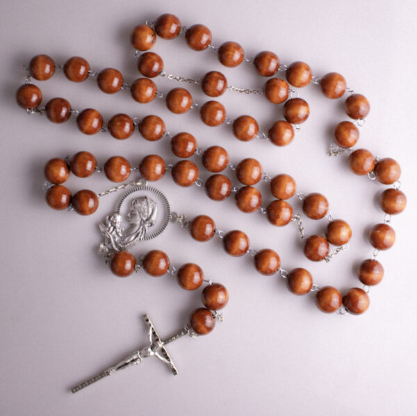 Brown wood wall rosary